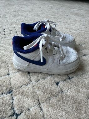 Nike Kids White Sneakers with Navy Blue Swoosh